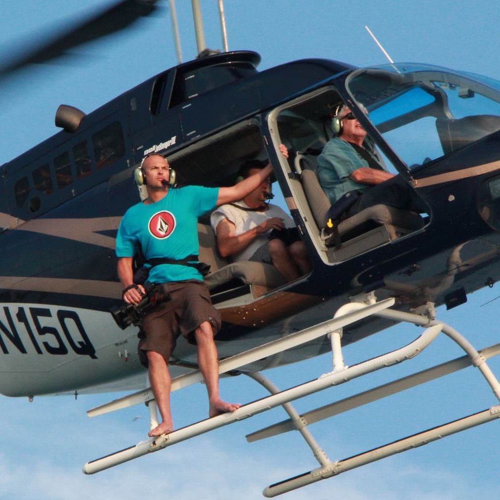 Slater Productions camera operator filming from a helicopter