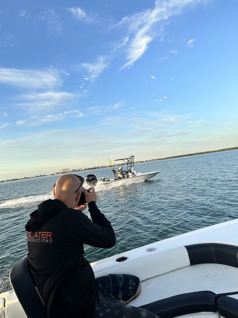JJ Slater photographing a boat during a marine production shoot