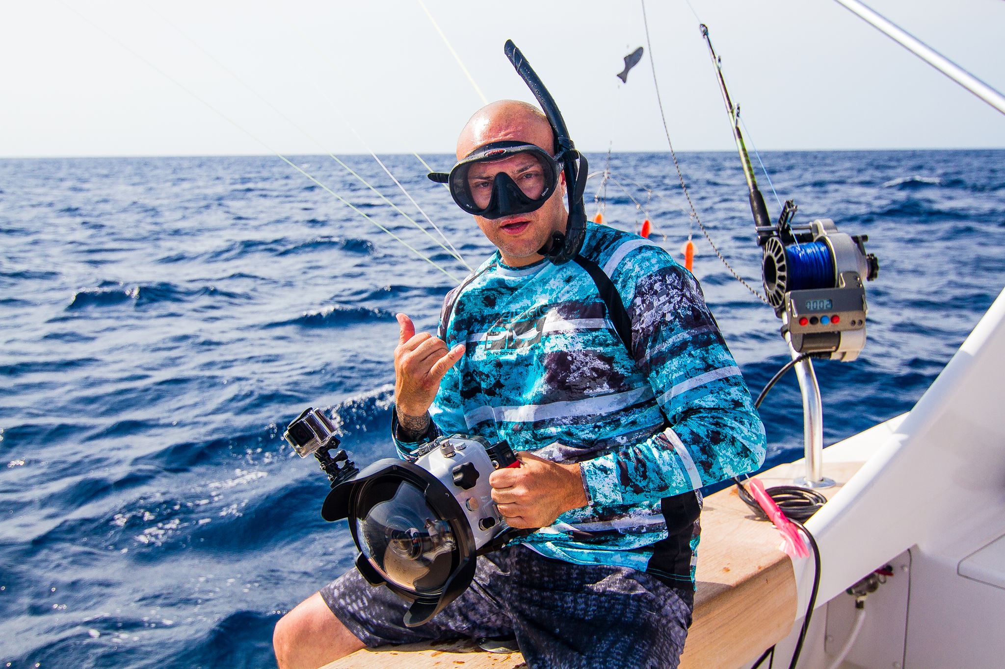 JJ Slater holding an underwater camera housing during a marine production